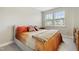 Inviting bedroom featuring a comfortable bed, two windows bringing in natural light, and modern decor at 127 Manordale Dr, Chapel Hill, NC 27517
