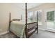 Bedroom with a four poster bed, neutral walls, and carpet at 127 Manordale Dr, Chapel Hill, NC 27517