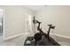 Exercise area includes a Peloton bike and doorway to a bathroom at 127 Manordale Dr, Chapel Hill, NC 27517