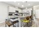 Modern kitchen featuring granite countertops, stainless steel appliances, and a kitchen island with seating at 127 Manordale Dr, Chapel Hill, NC 27517