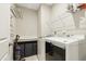 Convenient laundry room equipped with a washer, dryer, and ample storage space at 127 Manordale Dr, Chapel Hill, NC 27517
