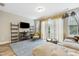 Bright living area showcasing shelving, seating and sliding glass doors bringing in natural light at 127 Manordale Dr, Chapel Hill, NC 27517