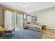 Cozy living room featuring a plush sectional sofa, stylish rug, and natural light from the sliding glass door at 127 Manordale Dr, Chapel Hill, NC 27517