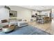 Open-concept living area with comfortable sofa and kitchen view with stainless steel appliances at 127 Manordale Dr, Chapel Hill, NC 27517