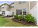 A spacious backyard with well-maintained lawn, patio, and privacy fence at 1310 Compass Dr, Durham, NC 27713