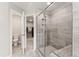 Modern bathroom features a glass-enclosed shower, and access to the closet and toilet area at 1310 Compass Dr, Durham, NC 27713