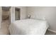 A cozy bedroom with a patterned bed, and easy access to the upstairs bathroom at 1310 Compass Dr, Durham, NC 27713