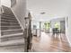 Open-concept living space with staircase, hardwood floors, and a seamless flow for modern living at 1310 Compass Dr, Durham, NC 27713