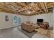 Basement featuring a comfortable seating area with a sofa, chair, and walkout to the exterior at 137 Lanigan Pl, Cary, NC 27513