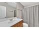 Well-lit bathroom featuring a light wood vanity, a large mirror, and a shower at 137 Lanigan Pl, Cary, NC 27513