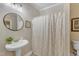 Bathroom featuring pedestal sink, neutral colors, and clean design at 137 Lanigan Pl, Cary, NC 27513