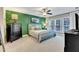 Stylish bedroom with green accent wall, comfortable bedding, and ample natural light at 137 Lanigan Pl, Cary, NC 27513