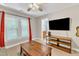 Bonus room with large windows, a ceiling fan, and a flat screen television at 137 Lanigan Pl, Cary, NC 27513