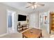 Bonus room featuring a ceiling fan, flat screen television, and open doorways at 137 Lanigan Pl, Cary, NC 27513