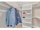 Organized walk-in closet with clothing racks, shelving, and ample storage space at 137 Lanigan Pl, Cary, NC 27513