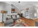Open living space with hardwood floors seamlessly connects to the dining area and offers a spacious feel at 137 Lanigan Pl, Cary, NC 27513