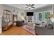 Inviting living room with stylish decor, warm hardwood floors, and large windows for plenty of natural light at 137 Lanigan Pl, Cary, NC 27513