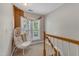Cozy sitting area with comfortable egg chair, natural light, and view of outdoor scenery at 137 Lanigan Pl, Cary, NC 27513