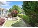 Backyard featuring patio with seating and decorative landscaping at 1405 Ventnor Pl, Cary, NC 27519