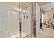Bathroom featuring a walk-in shower with glass door and ensuite access at 1405 Ventnor Pl, Cary, NC 27519