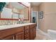 Bathroom featuring dual vanity sinks with ample storage and large mirrors at 1405 Ventnor Pl, Cary, NC 27519