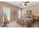 Comfortable bedroom with floral bedding, framed art, and natural light at 1405 Ventnor Pl, Cary, NC 27519