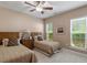 Bedroom featuring two twin beds and lots of natural light at 1405 Ventnor Pl, Cary, NC 27519