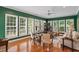 Living room with large windows and hardwood floors at 1405 Ventnor Pl, Cary, NC 27519