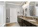 Bathroom featuring double sinks, granite countertops, and modern lighting at 1520 Palmer Hill Dr, Durham, NC 27703