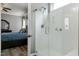 Modern shower featuring clear glass door and chrome fixtures, next to main bedroom at 1520 Palmer Hill Dr, Durham, NC 27703