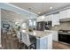 Stylish kitchen featuring a granite island, stainless appliances, and open access to the dining and living areas at 1520 Palmer Hill Dr, Durham, NC 27703