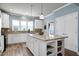 Charming kitchen featuring a large granite island, sleek appliances, and ample cabinet space at 1520 Palmer Hill Dr, Durham, NC 27703