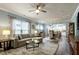 Open-concept living room and dining area with modern lighting and neutral decor at 1520 Palmer Hill Dr, Durham, NC 27703