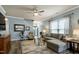 Bright living room featuring a comfortable couch, modern decor, and hardwood floors at 1520 Palmer Hill Dr, Durham, NC 27703