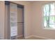 Bedroom featuring closet with drawers and shelves next to a window at 1536 Granville Street, Burlington, NC 27215
