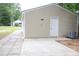 Exterior shot of the garage showcasing its neutral siding and door at 1536 Granville Street, Burlington, NC 27215
