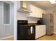 Spacious kitchen boasts stainless steel appliances, ample cabinetry, and stylish countertops at 1536 Granville Street, Burlington, NC 27215