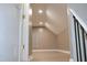 Loft featuring neutral paint, a vaulted ceiling and light-colored flooring at 1536 Granville Street, Burlington, NC 27215