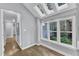 Bright breakfast room has skylights, beautiful windows and an updated pendant light fixture at 1702 Falls Church Rd, Raleigh, NC 27609