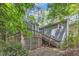 Back exterior view with two-story deck and stairs at 1702 Falls Church Rd, Raleigh, NC 27609