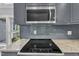 Kitchen features stainless steel appliances, granite countertops, and gray subway tile backsplash at 1702 Falls Church Rd, Raleigh, NC 27609