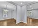 Spacious living area with gleaming hardwood floors and plenty of natural light at 1702 Falls Church Rd, Raleigh, NC 27609