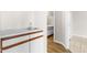 Bathroom featuring a vanity sink with white countertops and wood cabinets in a neutral-toned space at 1724 Briarforest Pl, Raleigh, NC 27615