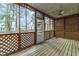 Screened porch with latticework, providing an ideal outdoor space for relaxation and entertainment at 1724 Briarforest Pl, Raleigh, NC 27615
