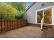 Backyard with brick steps and view of the house siding and slider at 173 Clancy Cir, Cary, NC 27511
