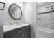 Renovated bathroom showcasing marble counters and a tiled shower/bath combo at 173 Clancy Cir, Cary, NC 27511