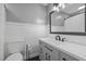 Updated bathroom boasts wainscoting, a modern vanity, and stylish fixtures at 173 Clancy Cir, Cary, NC 27511