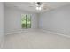 An empty bedroom with a large window and ceiling fan at 173 Clancy Cir, Cary, NC 27511