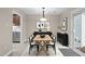 Dining room with modern floors, stylish furniture, contemporary art, and a sliding door to a private backyard at 173 Clancy Cir, Cary, NC 27511