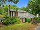 Two-story home with gray siding, brick accents, and mature landscaping at 173 Clancy Cir, Cary, NC 27511